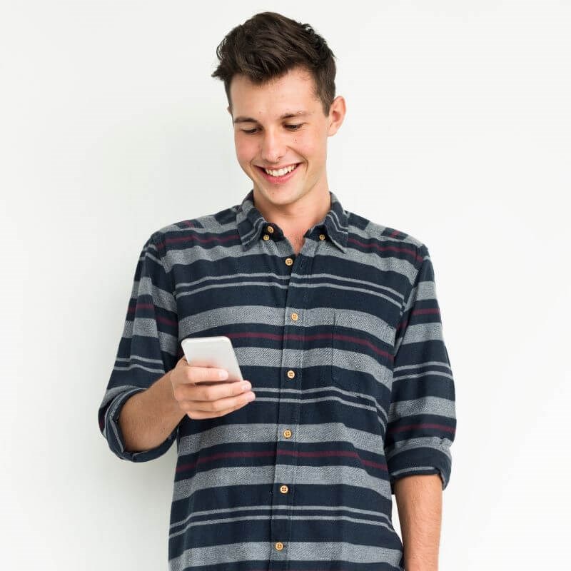 Man smiling at his phone